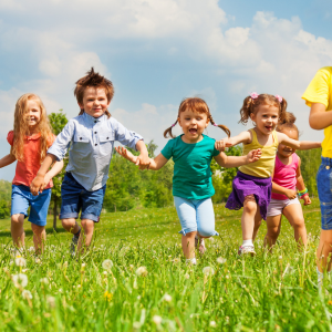 Young Children Running Outside in Spring